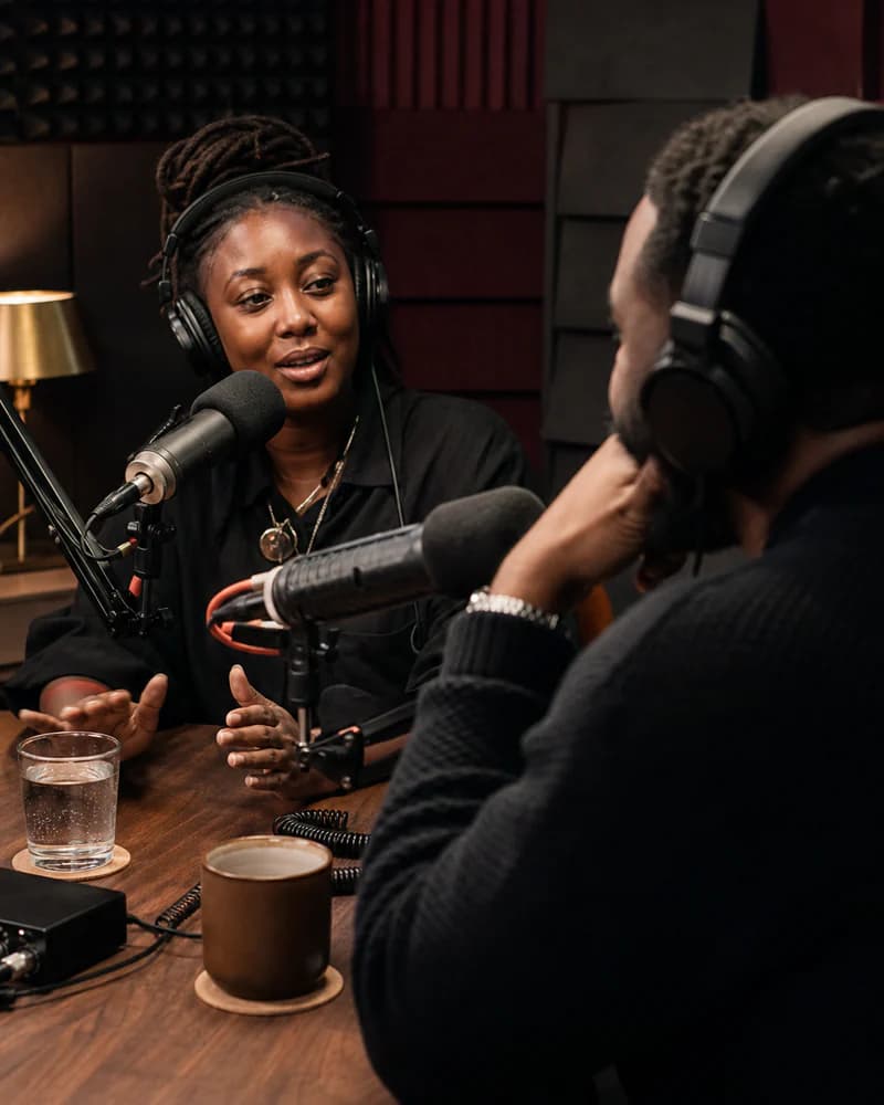 Two creative practitioners in conversation across studio microphones