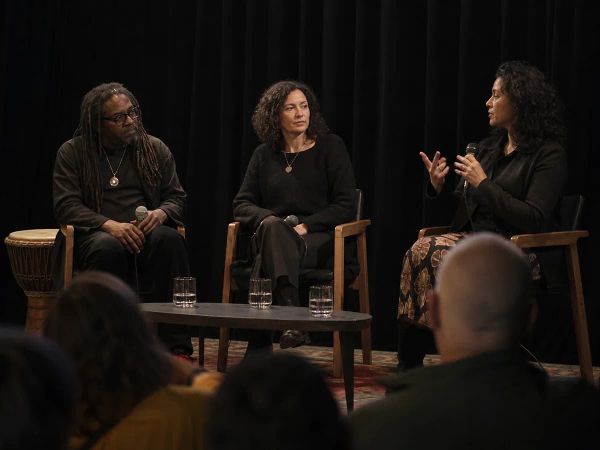 Panel discussion on stage with cultural researchers and musicians
